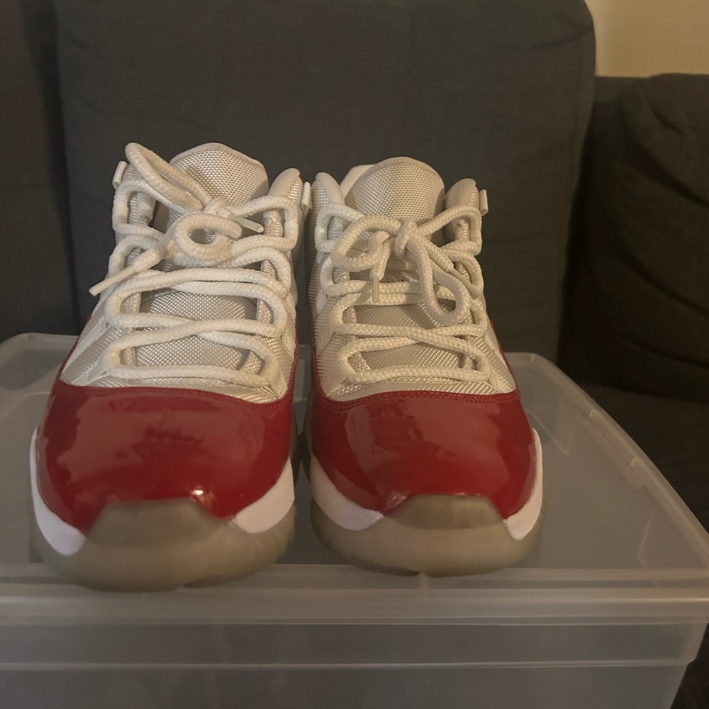 Air Jordan 11 Retro Low Cherry 2016 has an upper that is made of a white mesh.